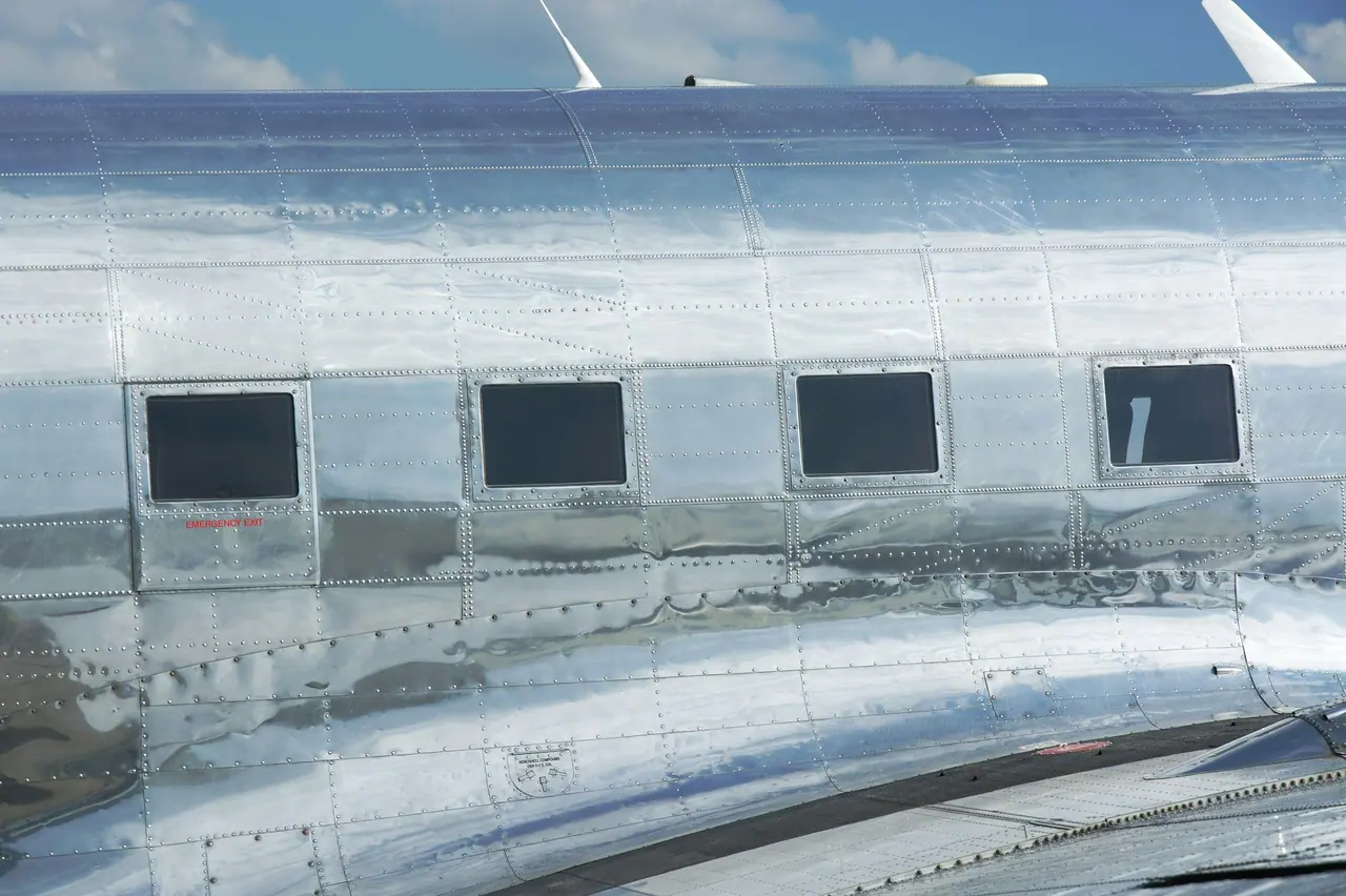 After: polished aluminium fuselage panels and cabin windows of a vintage airliner